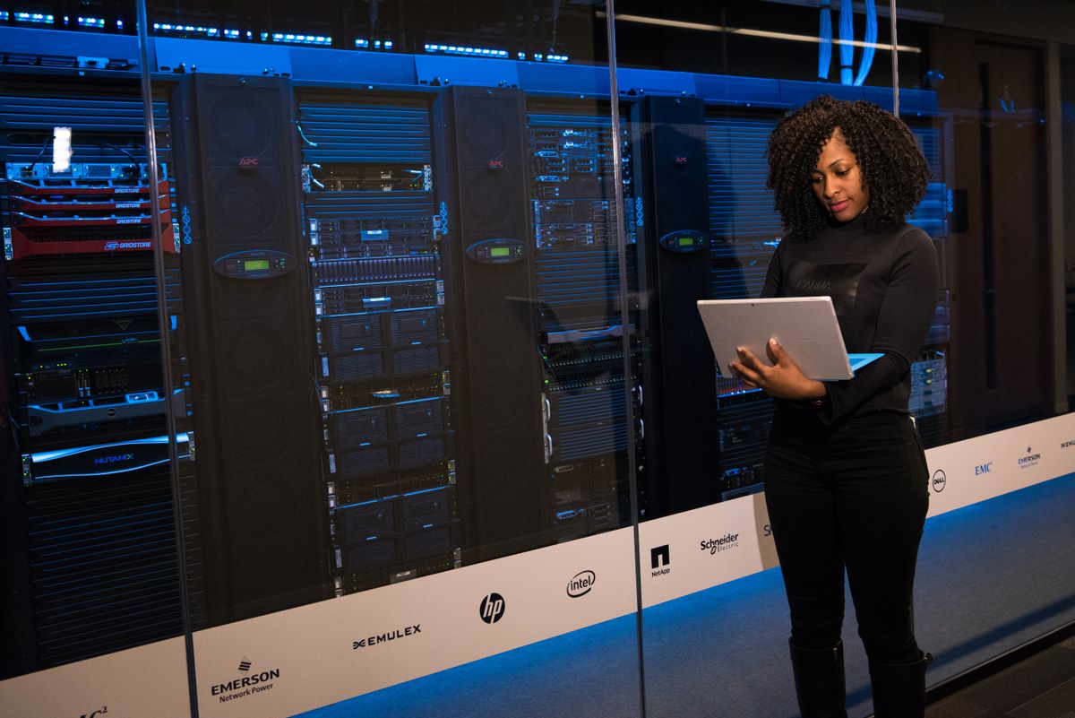 DevOps engineer salary in India 2026 - engineer working beside server racks